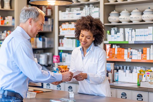 Image of a pharmacist helping a patient