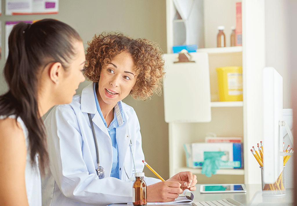 Pharmacist consulting with patient