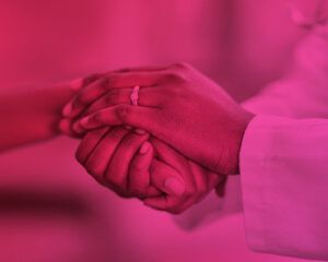 Two people holding hands